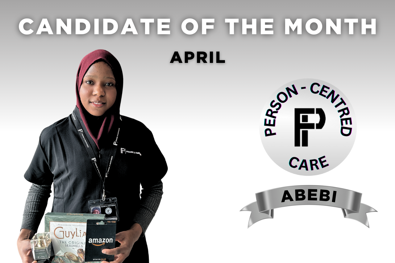 Our caregiver of the month poses with her prizes